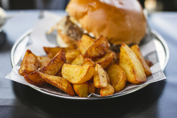 Hamburger with provolone, radicchio, bacon and delicious french fries