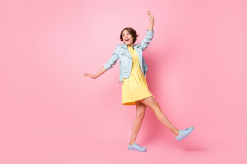 Full length photo of funny pretty young girl turquoise walking dancing isolated pink color background