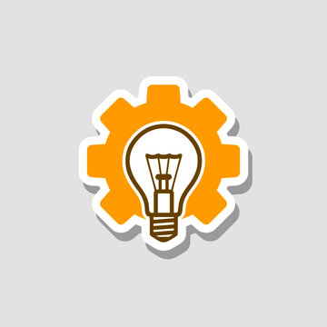 Light bulb and gear icon isolated on gray background