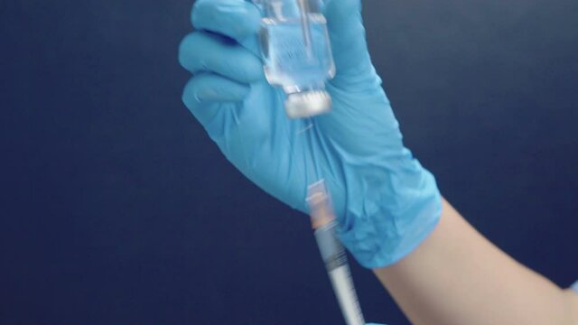Close up shot of injection Doctors prepare antiviral drugs.