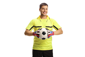 Goalkeeper holding a ball and smiling