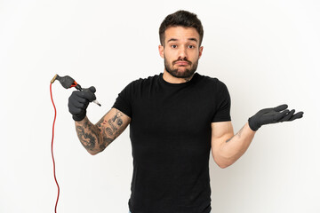 Tattoo artist man over isolated white background having doubts while raising hands
