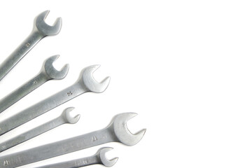 Set of wrenches on a white background.