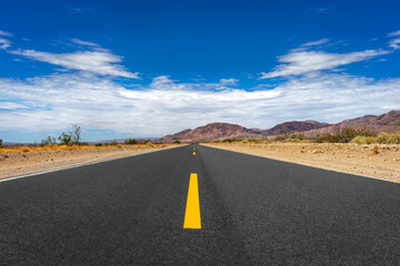 Long empty road in the Mojave Desert in California