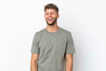 Young caucasian handsome man isolated on white background laughing