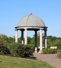 The stone domed gazebo in the park on a sunny day.