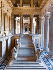 Entrance of the Palais de Justice in Brussels, Belgium. Seeing huge stone pillars surrounding the...