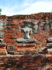 Headless buddha statue in Ayutthaya ruins temple heritage site
