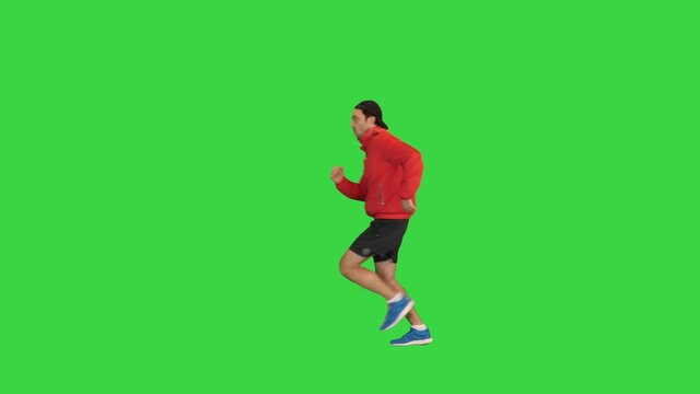 Man running from one side to another on a Green Screen, Chroma Key.