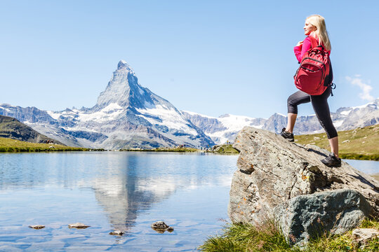 woman looking at the beautiful Mount Matterhorn in the Swiss Alps
