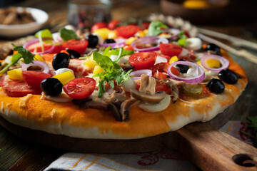 Homemade pizza on a rustic table