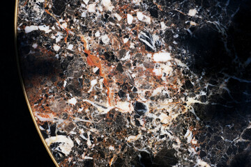 round marble countertops on a dark background. stylish table piece of furniture in the living room. marble texture close-up. mockup