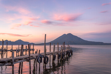 Spectacular and peaceful landscape of a sunrise at the docks of Panajachel, Lake Atitlán, in the...
