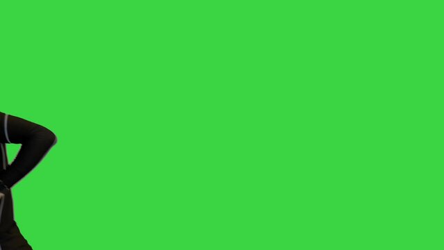 Running fitness man using phone to take a photo on a Green Screen, Chroma Key.