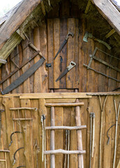 Beautifully designed wooden shed, with antique tools