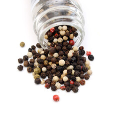 Red and black peppercorns, isolated on white background 
