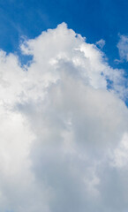 Picturesque white cloud in the blue sky, vertical format