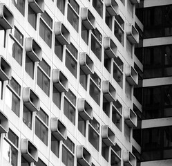 A black and white shot of a cubic windowed hotel block giving a very abstract feeling