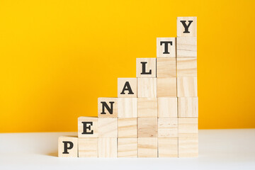 the word penalty is written on a wooden cubes, concept