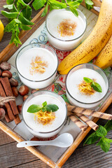 Fresh banana yogurt with oats, delicious dessert for healthy breakfast