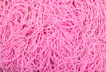 Full frame of pink beads on the fishing line.