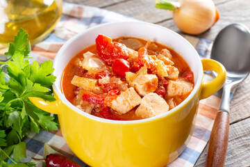 Traditional Hungarian paprika chicken, also known as chicken paprikash in juicy sour cream sauce and parsley