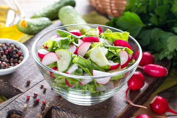 Cucumber and radish salad in a glass plate. Healthy food