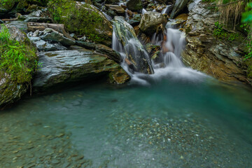 Naklejka na ściany i meble Nice color clean creek near Huttschag village in summer hot day