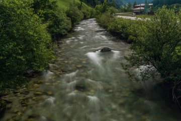 Grossarler Ache river in sunny cloudy morning in Austria