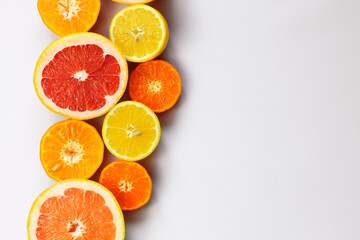 Sliced citrus on a white background. Grapefruit, lemon, tangerine.