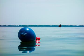 A floating ship buoy near the port, serves as a floating anchor for ships