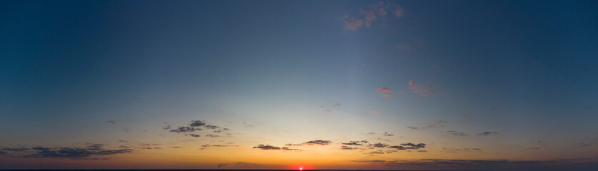 Orange sunset. Panorama of the evening sky.