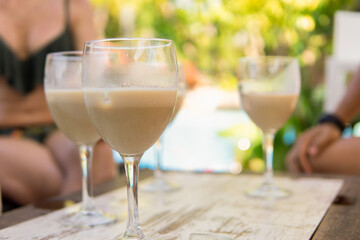 Friends having a refreshing drink in a bar to beat the heat