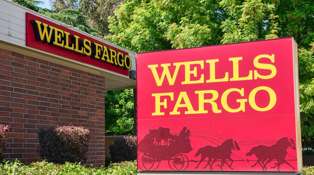 Wells Fargo Sign And Stagecoach Logo Near Local Bank Branch - San Jose, California, USA - 2021