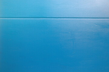 Light blue texture. Wooden wall. Close up and isolated. A thin line at the top. Horizontal. Stockholm, Sweden.