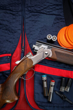 Background for creating a clay skeet shooting poster. Clay target plates for shooting with rifle on wooden background.