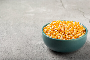 Dried corn. Raw corn for popcorn on the table.