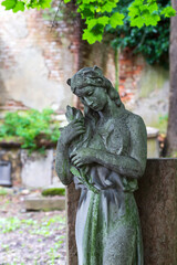 Historic Statue on the mystery old Prague Cemetery, Czech Republic