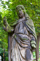 Fototapeta premium Historic Statue on the mystery old Prague Cemetery, Czech Republic
