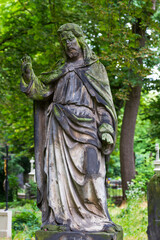 Fototapeta premium Historic Statue on the mystery old Prague Cemetery, Czech Republic