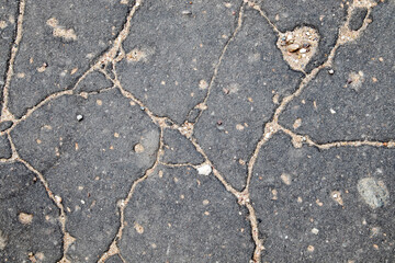 asphalt crack, black asphalt with deep cracks