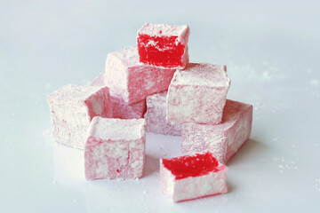 Sweet pieces of turkish delight on white background