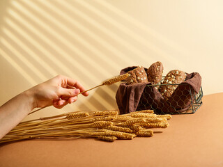A beautiful composition of cereals and black grain bread, which lies in an openwork basket on a...