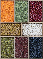 various types of dried vegetables in rectangular wooden boxes