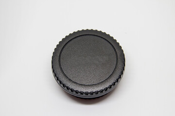 cover for photographic camera body and photographic lens body on a black background.