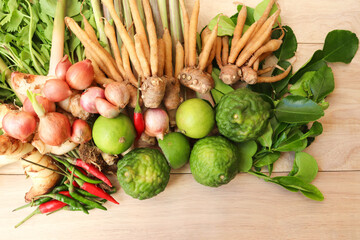 Many vegetables green fresh for herbs isolated on wooden background closeup.