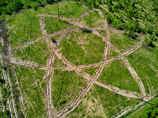 Geoglyph in the form of an atom symbol, an outline where trees are planted, aerial view. District...