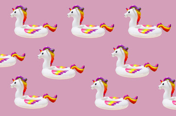 inflatable circle or ring for kids rainbow unicorn for floating in summer vacation isolated on pink background, inflatable toy pattern