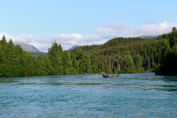 Fototapeta na wymiar Anglers test their skills on Alaska's Kenai River, famous for world-class salmon and trout fishing.