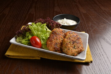 indian Malay style baked potato cake vegetarian with chef special salad tartar sauce on wood table appetiser halal menu